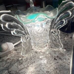 Glass Angel Wing wax melt the light dims and go up too. It’s beautiful vintage
